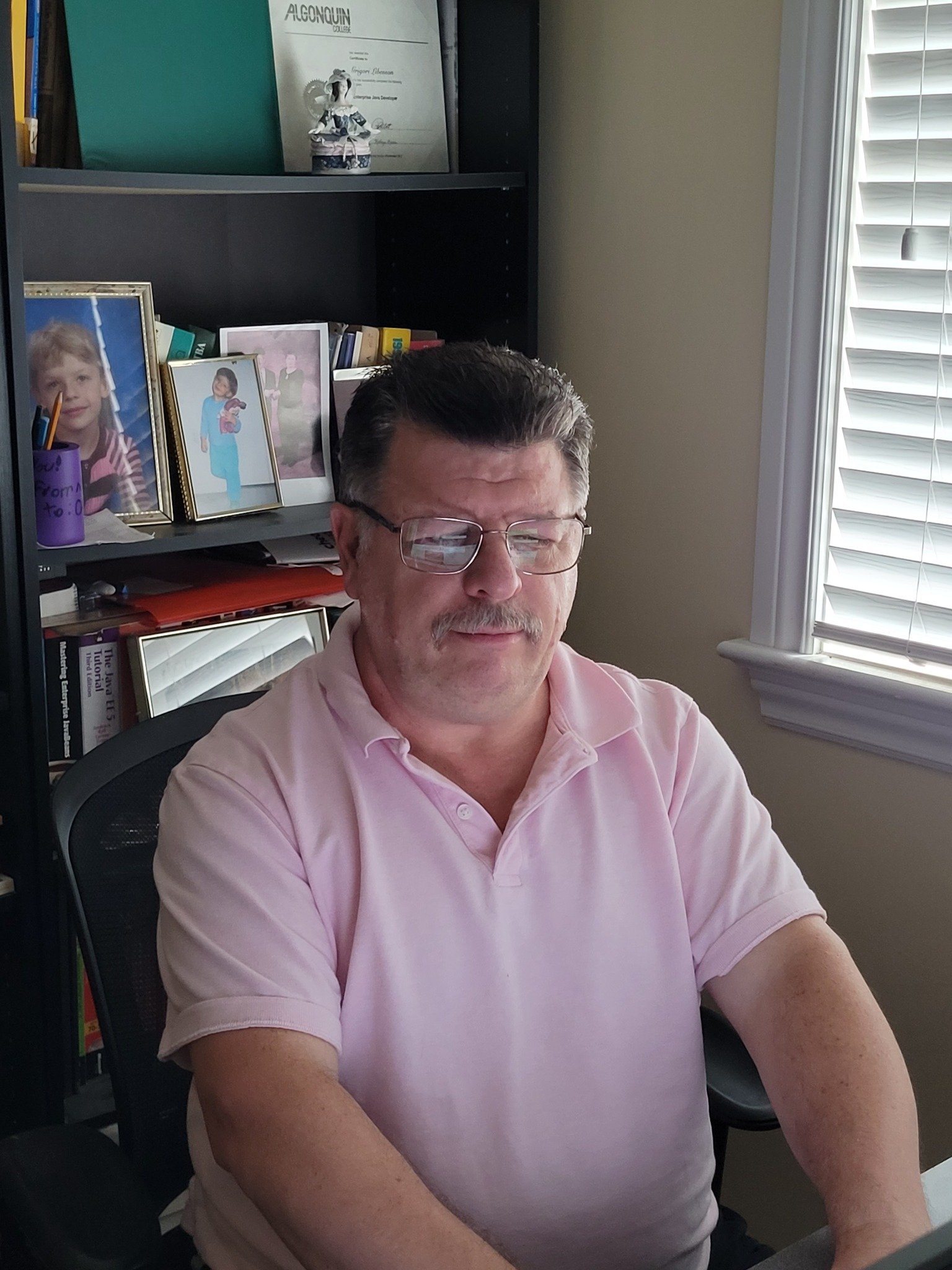 Greg Libenson seated in his home office